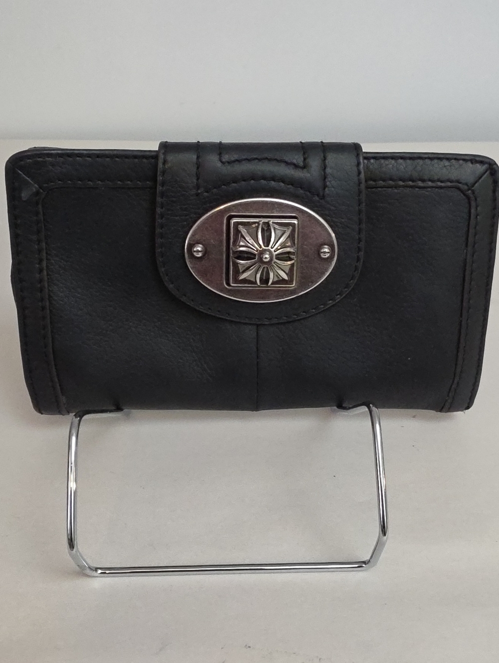 b. makowsky Black Leather Wallet with Silver Decorative Emblem